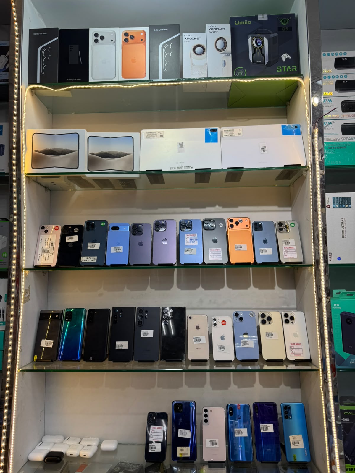 Real iPhones on display at Taher Mobile Phones, Rashidiya 2, Ajman